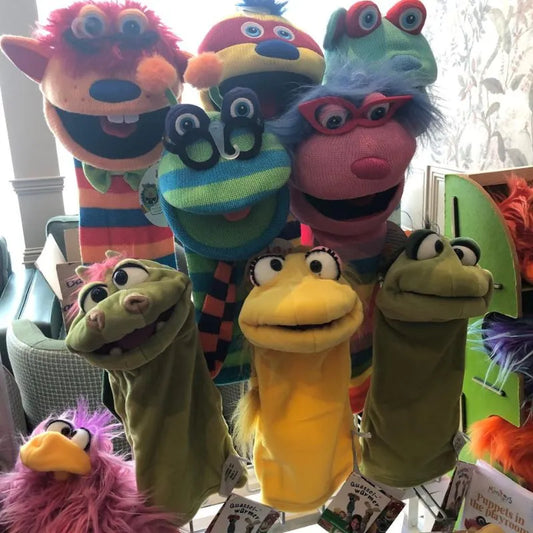 Super colourful Hand Puppets displayed on a table.