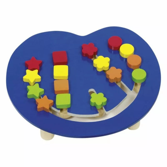 The Colour Assorting Board is a heart-shaped, blue wooden puzzle that enhances logical thinking with geometric pieces like stars, flowers, and circles. The grooves arrange these vibrant shapes into a colorful concentration game display.