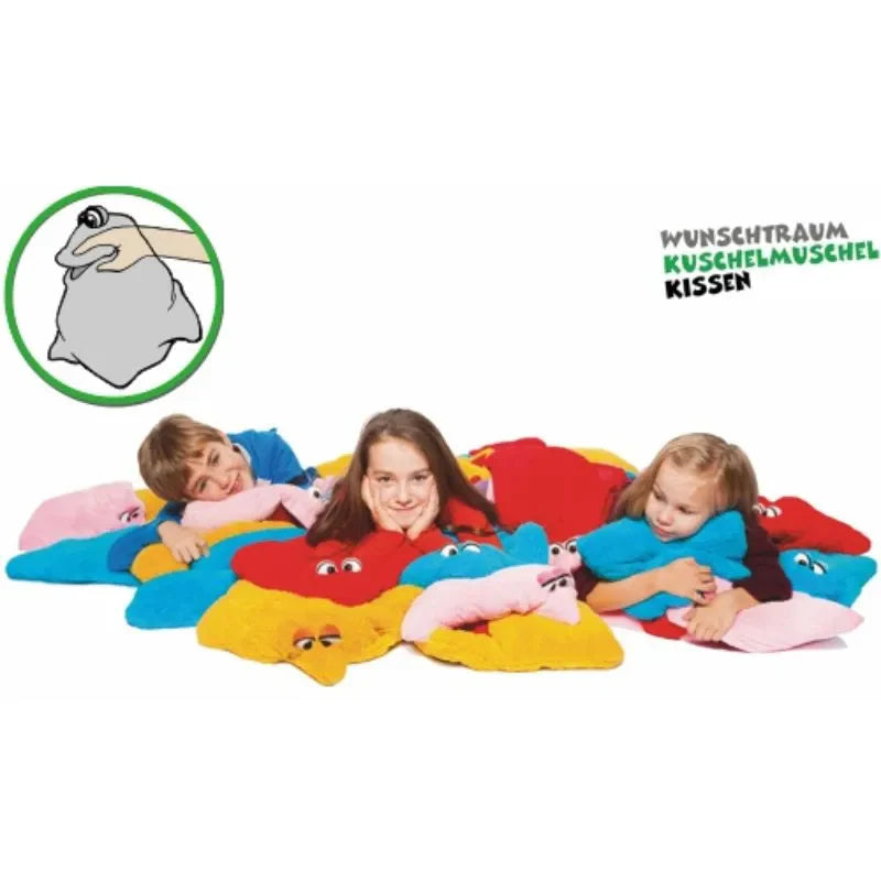 Children lie on colorful, star-shaped cuddly pillows with smiling faces, set against a white background. In the top left corner, there's a small illustration of a hand holding a gray object. Text reads: "Cuddle Hand Puppet Pillow Pink.