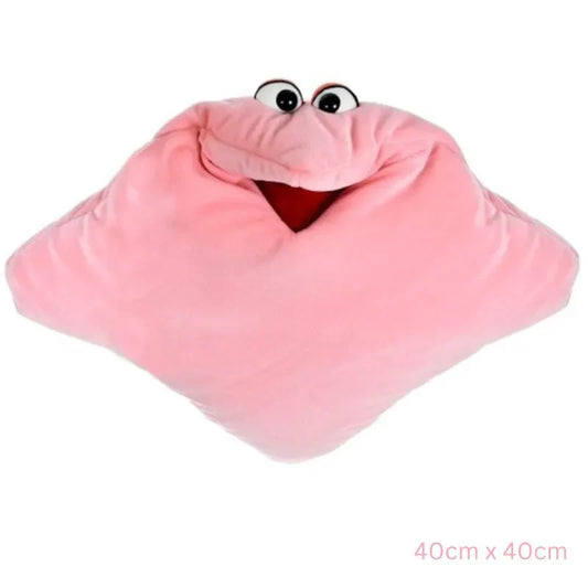 The Cuddle Hand Puppet Pillow Pink is a 40cm x 40cm cuddly accessory featuring googly eyes and a smiling face with a red mouth, resembling a playful character—perfect for hugs and sensory fun.