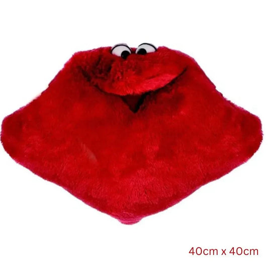 The Cuddle Hand Puppet Pillow Red is a plush, whimsical square-shaped sensory toy with googly eyes, resembling a cartoon character. Its dimensions are 40cm by 40cm.