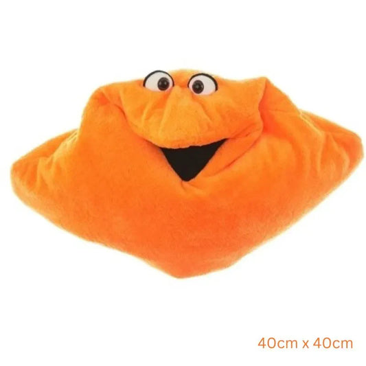 The Cuddle Hand Puppet Pillow Orange is a bright orange plush with a whimsical cartoon face, wide eyes, and a big smile. It serves as both a cuddly pillow and sensory toy for endless comfort. Dimensions are 40cm x 40cm.
