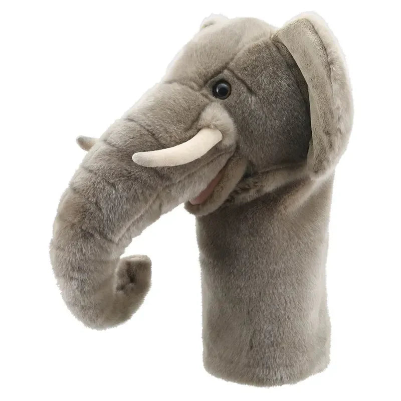 Introducing the Jumbo Friends Elephant Hand Puppet, a plush puppet with gray fur, white tusks, and dark eyes. Its upward-curving trunk and floppy ears add charm to imaginative play. Easily access the hand opening at the base of its neck for effortless fun.