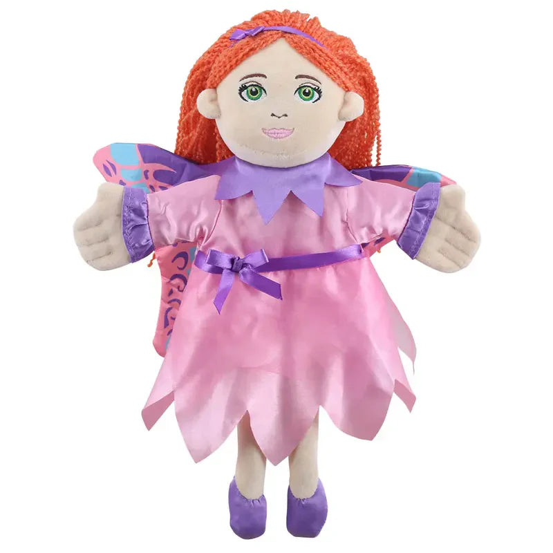 The Puppet Company Fairy Hand Puppet features long orange yarn hair, green eyes, a lilac-purple dress with a pink sash, purple shoes, and colorful wings with pink and blue accents—ideal for imaginative play and storytelling.