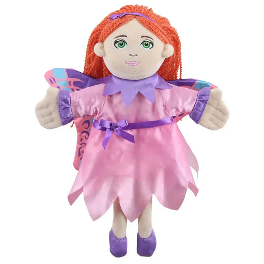 The Puppet Company Fairy Hand Puppet features long orange yarn hair, green eyes, a lilac-purple dress with a pink sash, purple shoes, and colorful wings with pink and blue accents—ideal for imaginative play and storytelling.