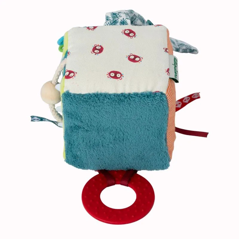 The Lilliputiens I'm Discovering Jack Activity Cube is ideal for development, showcasing plush teal fabric with patterns and a red teething ring on one side to engage your baby's senses with diverse textures.