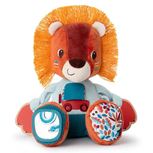 The Lilliputiens I'm Discovering Jack Multi-Activity Lion is a colorful plush toy with a bright orange mane, smiling face, blue and red patterned feet, and a soft toy truck. Perfect as a sensory toy to encourage curiosity, it features painted-like stripes on its cheeks.