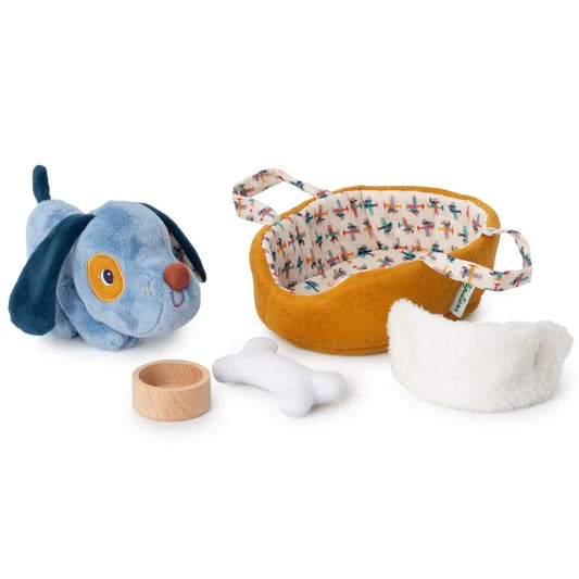 Explore the Lilliputiens I'm Exploring Jules Dog With Basket, featuring a plush blue puppy with a removable coat, yellow fabric basket with patterned lining, white plush pillow, toy bone, and round wooden dish. Perfect for kids' playtime adventures!.