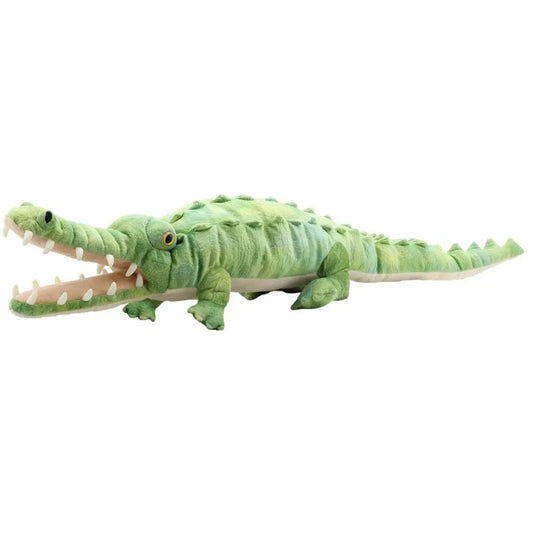 The Puppet Company Large Creature Crocodile features a plush green design, detailed scales, and yellow eyes. Its long pointed snout and open mouth with white teeth make it perfect for imaginative play as it lies flat on its stomach with short legs.