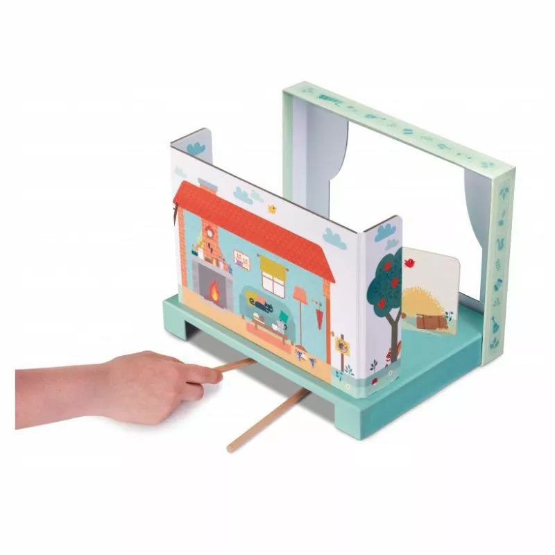 A child is playing with the Lilliputiens Wolf and 3 Little Pigs Magnetic Theatre.