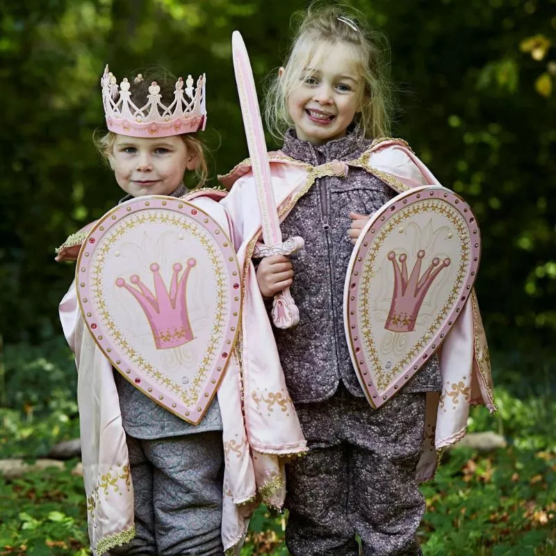 Two kids dressed up with Liontouch Queen Rosa Shield as princess puppets for a puppet show.