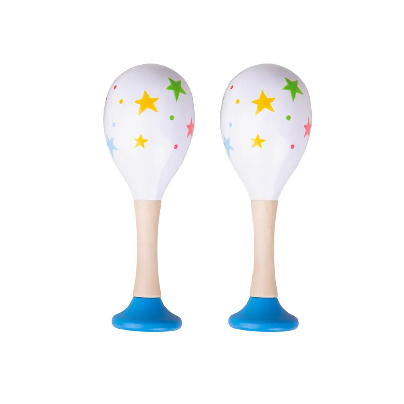 The Bigjigs Junior Maracas Blue are two white, toddler-friendly maracas with blue handles, adorned with yellow stars and colorful dots, standing upright against a plain white background. They offer a delightful introduction to rhythm and sound for little ones.
