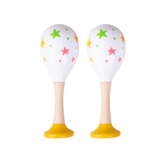 The Bigjigs Junior Maracas Yellow are two white maracas with colorful stars and dots, featuring wooden handles and bright yellow bases, ideal as musical toys to inspire toddlers' rhythmic creativity.