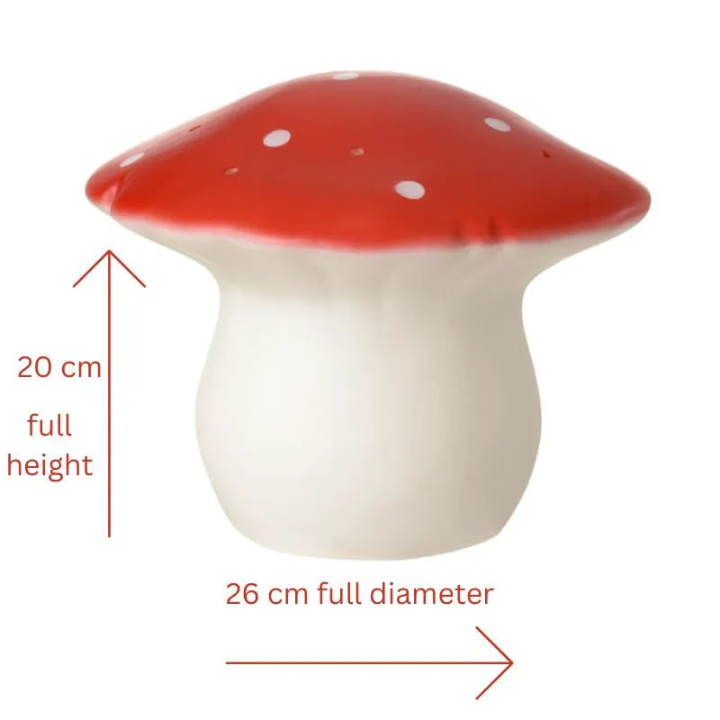 The Lamp Medium Mushroom Red is a hand-painted lamp with a red cap, white spots, and white stem. It stands 20 cm tall and 26 cm across, making it a whimsical decor piece for a child's room. Dimensions are shown with arrows and text.