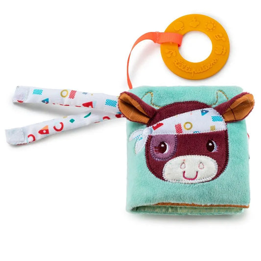 The Lilliputiens I'm Discovering Playbook Farm is a soft, farm-themed playbook featuring a cow face cover with fabric ears and colorful rings. It has crinkly pages, an orange teething ring, and primary-colored geometric pattern tabs, ideal for little explorers.