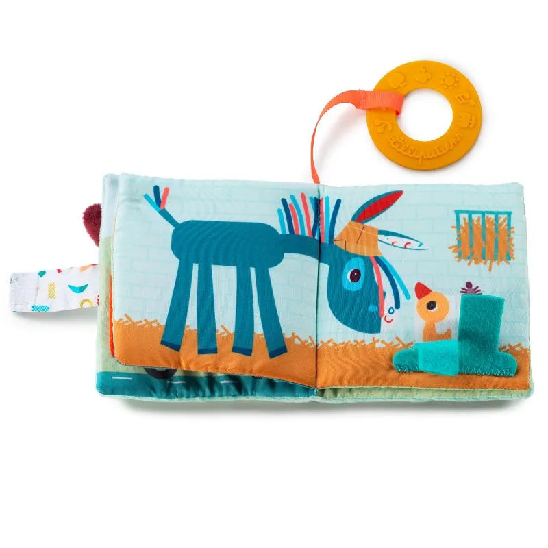 The Lilliputiens I'm Discovering Playbook Farm features a blue donkey and yellow bird, crinkly pages, a sensory teething ring, various textures and colors, and a hanging orange ring, all in a vibrant children's soft farm-themed playbook.