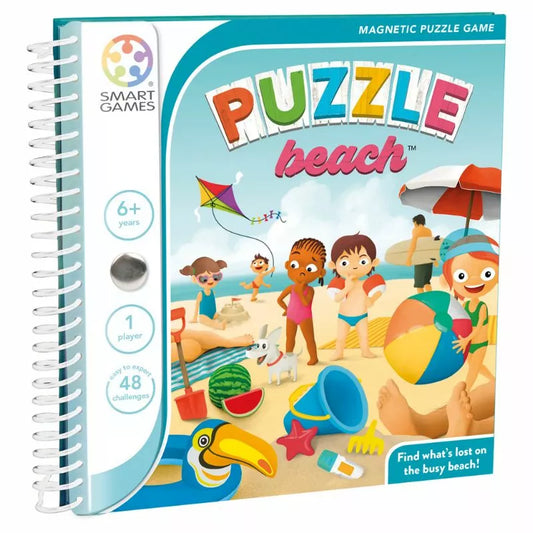 Smartgames Puzzle Beach cover displays colorful illustrations of kids playing with toys, beach balls, and a kite. Designed for ages 6+, it's a travel game including 48 solo challenges using magnetic puzzle pieces.