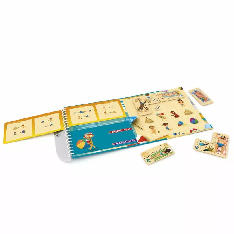 Smartgames Puzzle Beach is a children's educational activity set with a spiral-bound booklet and magnetic puzzle pieces. The booklet features a treasure map with illustrations, while the colorful pieces depict objects and characters, perfect for interactive learning and travel fun.