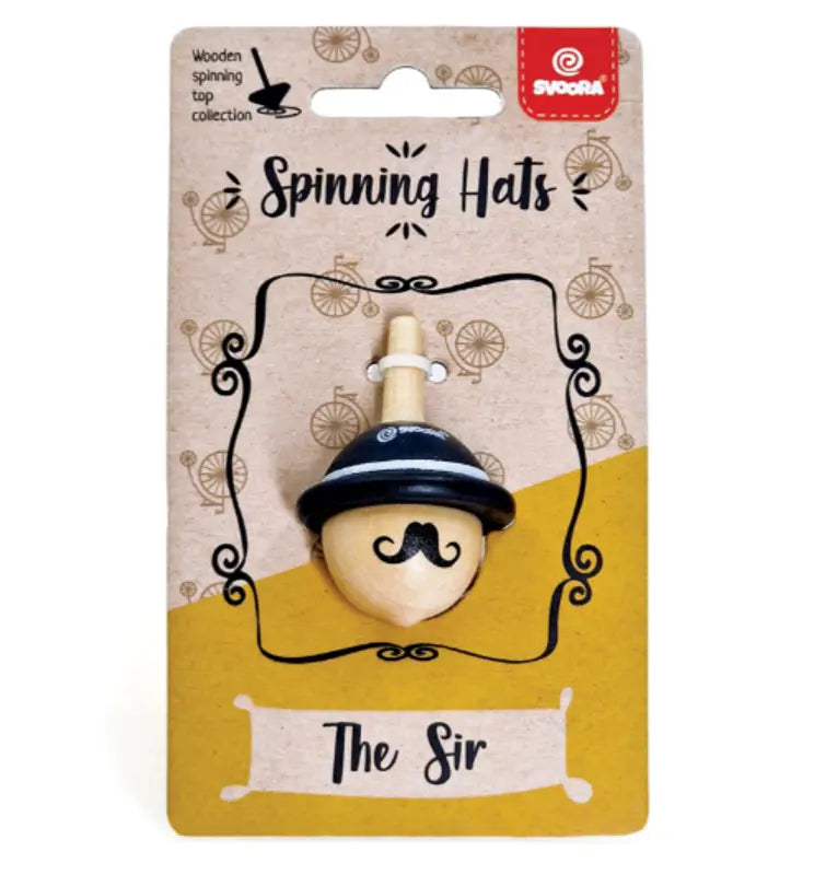 The Wooden Spinning Top The Sir, shaped like a mustached face with a black hat, helps children develop fine motor skills. It comes in brown packaging labeled “Spinning Hats - The Sir” with vintage bicycle graphics.