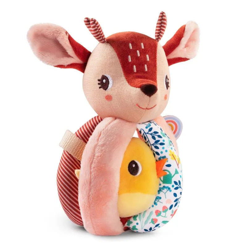 The Lilliputiens "I'm Discovering Stella The Faon Rattle With Handles" features a deer-shaped plush toy with embroidered eyes and antlers, holding a yellow chick and floral-patterned egg. Its red and cream colors, striped ears, and friendly face hide a soothing rattle to charm little ones.