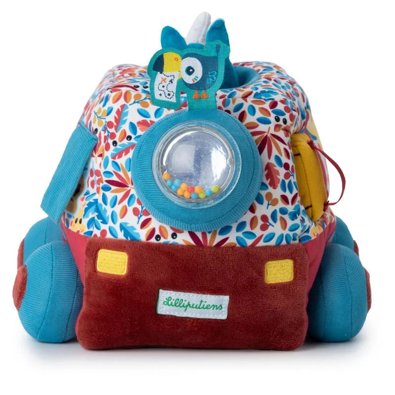The Lilliputiens I'm Discovering Activities Car Safari is a plush toy reminiscent of a retro TV with a floral pattern, blue and red accents, and features a clear dome filled with beads and an attached blue owl with embroidered details, perfect for sensory exploration in baby activities.