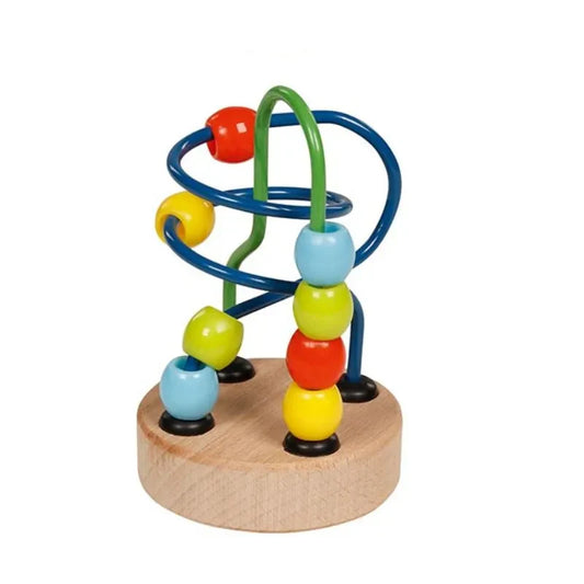 The Small Bead Maze Toy Green Blue is a charming plaything featuring vibrant beads in red, yellow, blue, and green on twisting metal tracks. It has a light wooden base that complements its whimsical design. This delightful stocking stuffer allows for seamless play as the beads glide smoothly along its engaging pathways.