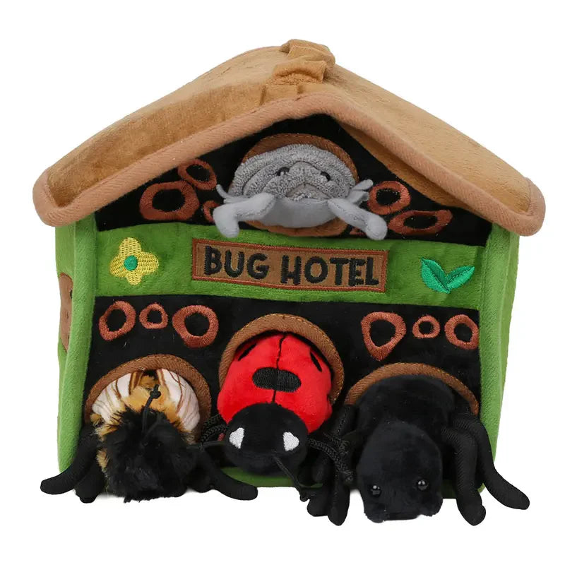 The Puppet Company Hide-Away Bug Hotel is a plush green and brown house with finger puppet bugs—spider, ladybug, bee, beetle—peeking out from holes, making it a fun and eco-friendly nature-inspired playset.