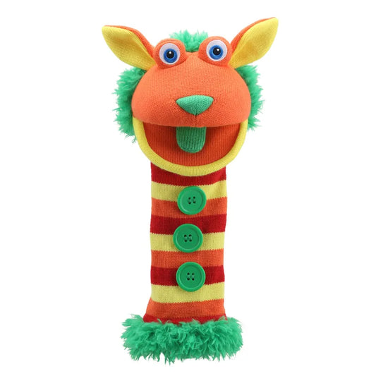 Introducing The Puppet Company Sockette Puppet Buttons! This vibrant puppet boasts a lively orange and yellow head with expressive googly eyes, complemented by a playful green fuzzy mane and tongue. Its cheerful body is decorated with red and yellow stripes, three whimsical green buttons, and is finished with soft green fur at the bottom for added charm.