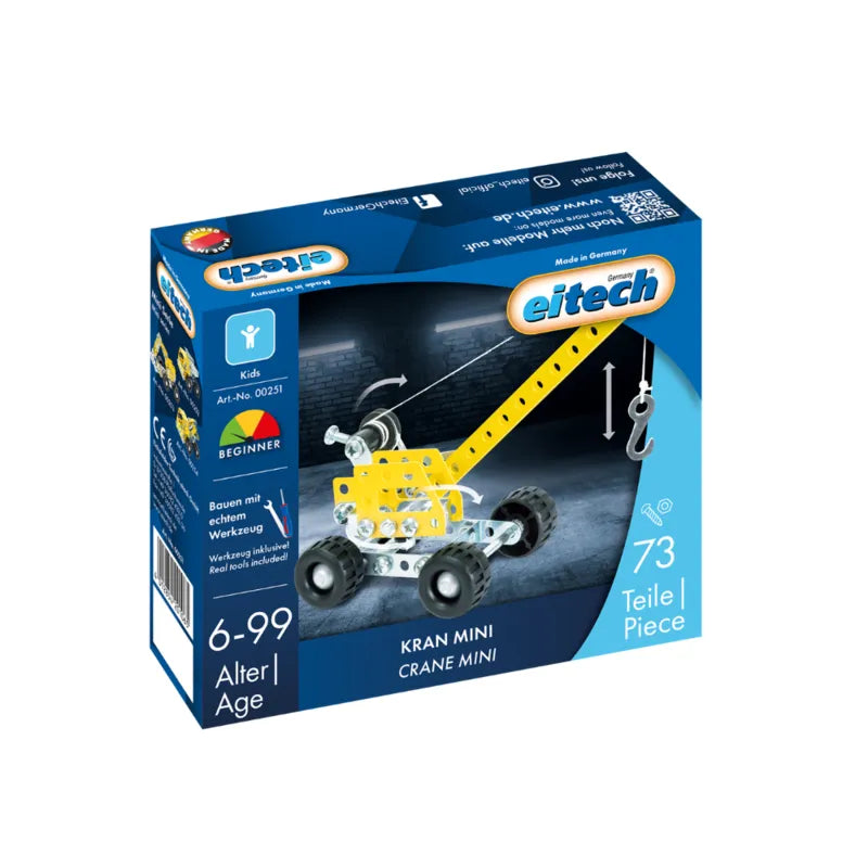The image shows a blue box containing an Eitech Construction Mini Crane set. Designed as a building toy for ages 6-99, the metal construction set includes 73 pieces and has part number 00351. The box features a small image of the assembled mini crane model.