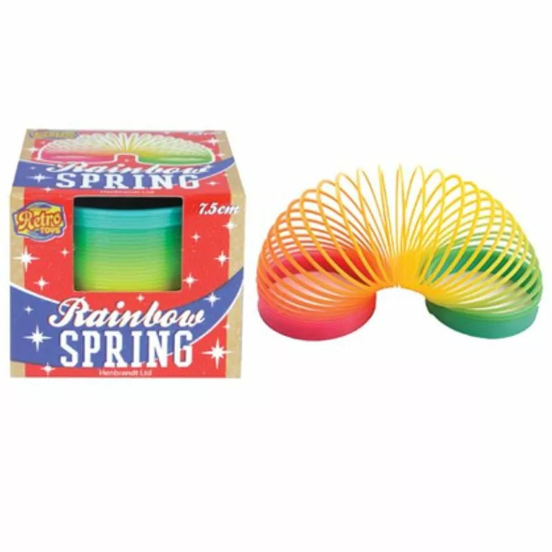 A colorful Coloured Springs 7.5cm toy next to its packaging box labeled "retro spring, 7.5cm" with a vibrant rainbow pattern spanning yellow, green, red, and blue colors designed to help