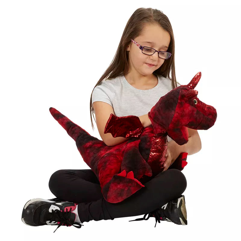A young girl confidently storytelling with an Enchanted Red Dragon Hand Puppet.