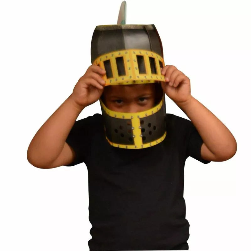 A young boy wearing a Fiesta Crafts 3D Mask Knight Helmet.