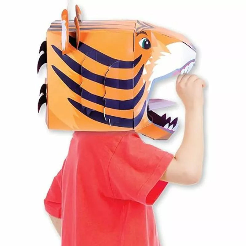 A child wearing a Fiesta Crafts 3D Mask Tiger kit.