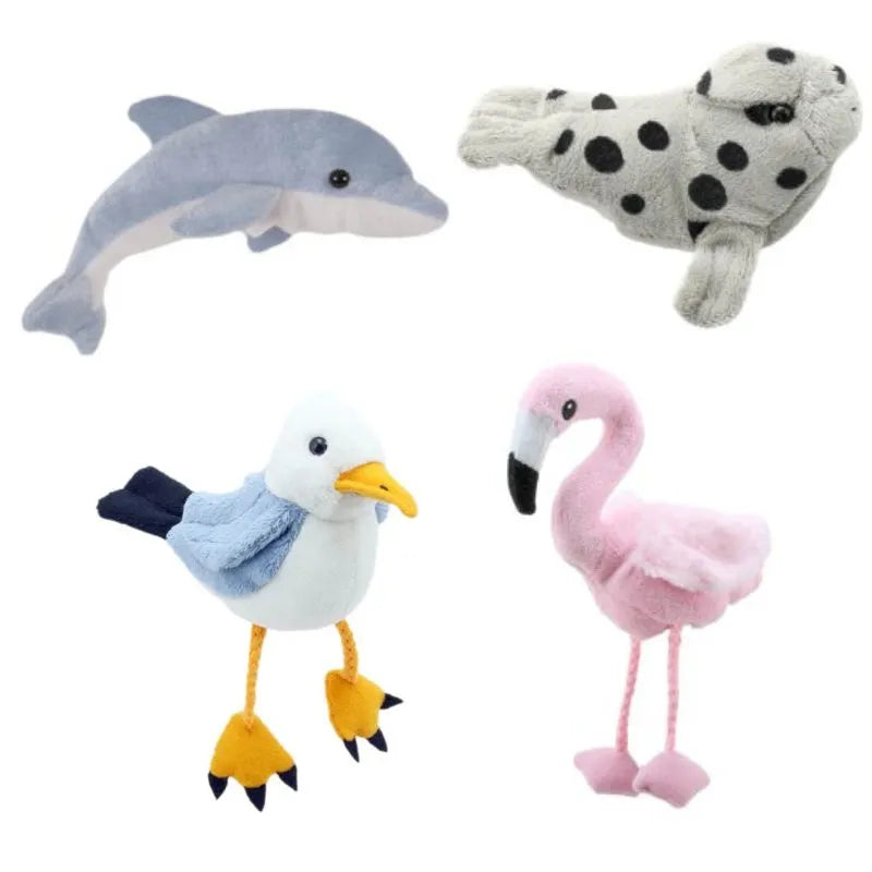 Displayed against a white background, the Water Finger Puppets Pack of 4 features four plush toys ideal for vocabulary building, including a dolphin, a spotted seal, a seagull with a yellow beak and webbed feet, and a pink flamingo with black-tipped wings and beak.