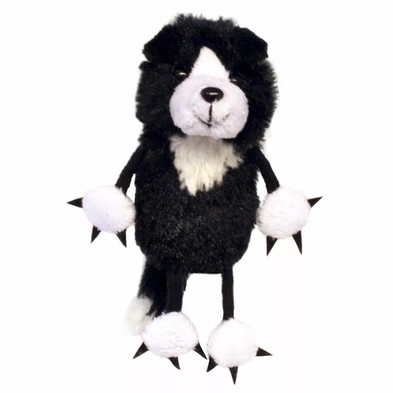 A black and white Kids's Puppet Company Border Collie Finger Puppet with claws for puppet shows.