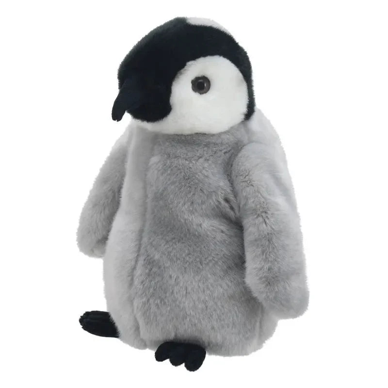 The Puppet Company Full-bodied Hand Puppet Penguin Chick features soft gray fur, a white face, and black beak and feet. Designed as a soft toy puppet, it helps encourage children's fine-motor skills. Sits upright against a white background.