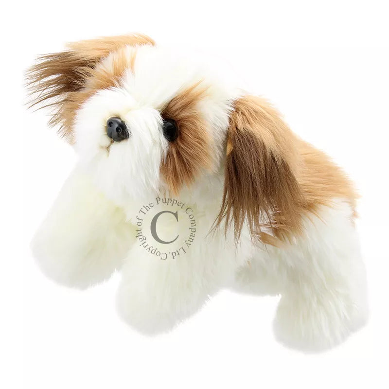 The Puppet Company Full-bodied Hand Puppet Dog is laying on a white background.