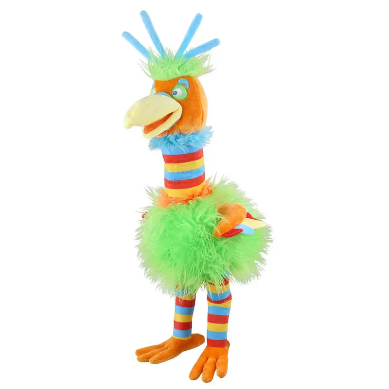 Introducing The Puppet Company Striders Bird Gizmo, a vibrant and user-friendly hand puppet. Standing upright, Gizmo boasts a prominent yellow beak, bright blue eyes, and multi-color striped legs and neck. His fluffy green body is complemented by orange wings and blue feather-like tufts on his head, making him the perfect companion for bringing stories to life!