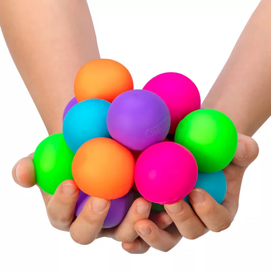 Two hands holding a cluster of vibrant, multicolored Gobs of Globs Needoh—including orange, purple, pink, and green—against a white background.