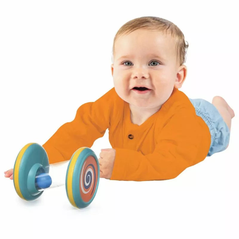 A baby is laying on the floor with a Halilit Spinning Tubes.