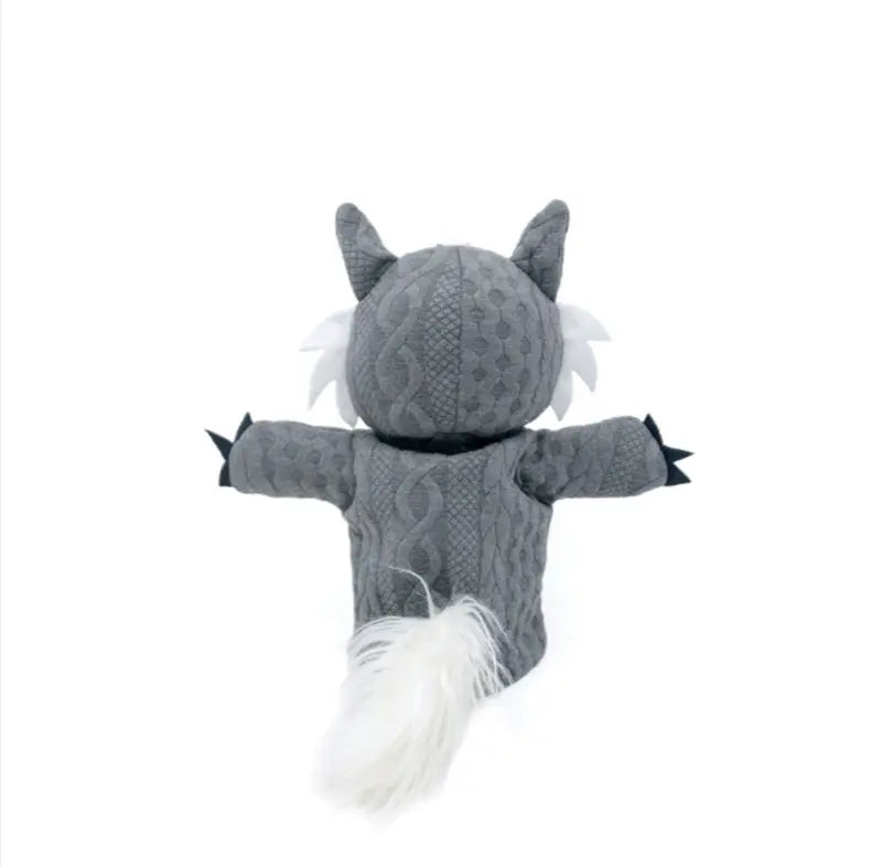The Hand Puppet Wolf features pointed ears, white fur tufts, black claws, and a fluffy white tail—ideal for storytelling and imaginative play. Displayed from the back on a white background.