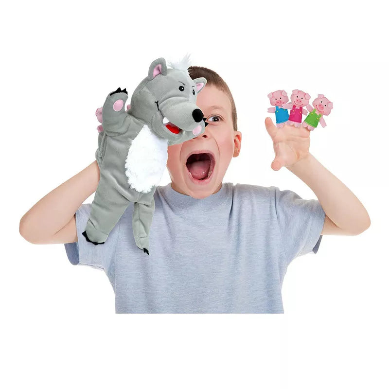 A boy is holding a puppet set for a kids' puppet show.