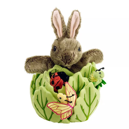 The Puppet Company Hide-Away Rabbit is a kids' puppet sitting in a lettuce leaf.