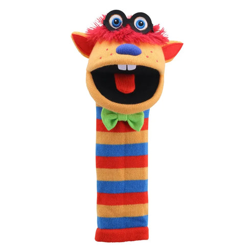 The Puppet Company Sockette Humphrey is a vibrant knitted puppet featuring a red fur top, big googly eyes, and a wide-open mouth. Adorned with a bright green bow tie, it boasts horizontal stripes in red, blue, orange, and yellow. For additional entertainment, it also includes a squeaker toy.