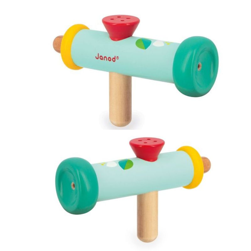 Two colorful Janod Gioia Wooden Trumpets made of wood and painted in bright hues, featuring a green front with a yellow ring, a red button on top, and a wooden handle below. The brand name "Janod" is visible on one side of the trumpets. Perfect additions to any baby toy box.