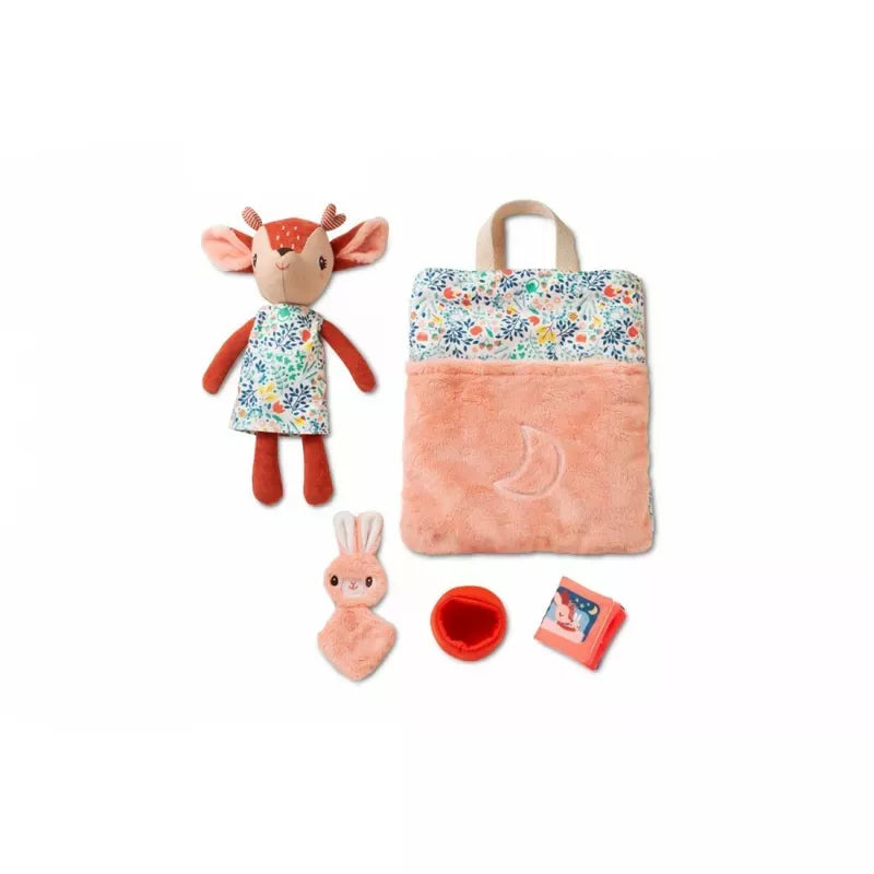 A charming children's play set featuring the Lilliputiens Stella Bed Time Ritual, a cozy sleeping bag with a floral pattern for bedtime routine, a tiny bunny toy, a miniature bowl, and a small book about bedtime routines.