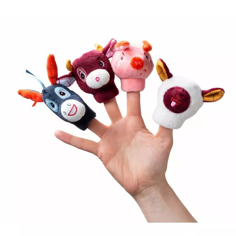 A hand displaying four Lilliputiens Farm Finger Puppets against a white background.