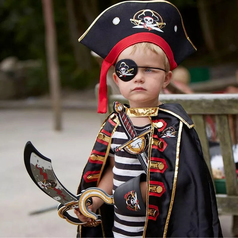 A young boy performing a puppet show as a Liontouch Pirate Sabre Captain.