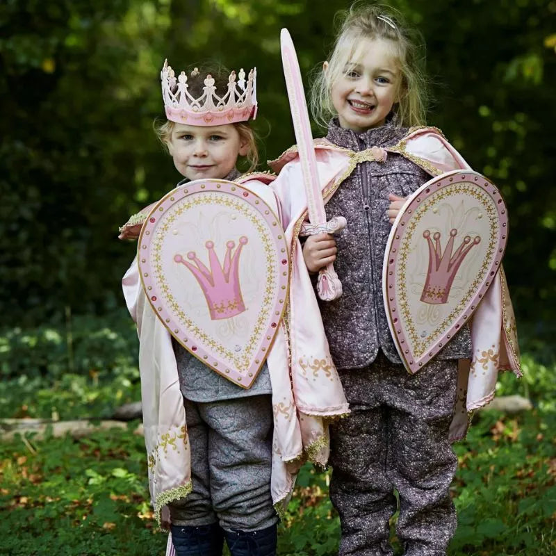 Two kids in puppet show costumes as Liontouch Queen Rosa Capes.