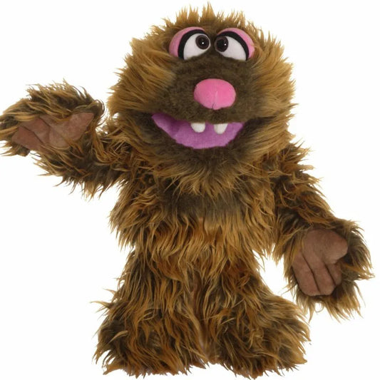 The Living Puppets Zoff Hand Puppet, with shaggy brown fur, large eyes, a pink nose, and a purple mouth with two teeth showing in its smile. Its raised left arm and open hand encourage imaginative play, making it an ideal toy gift.